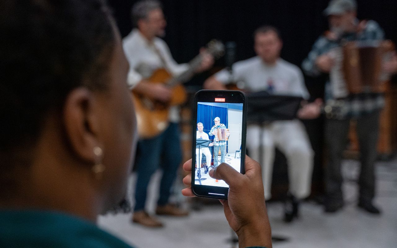 Man videos a group performing their song