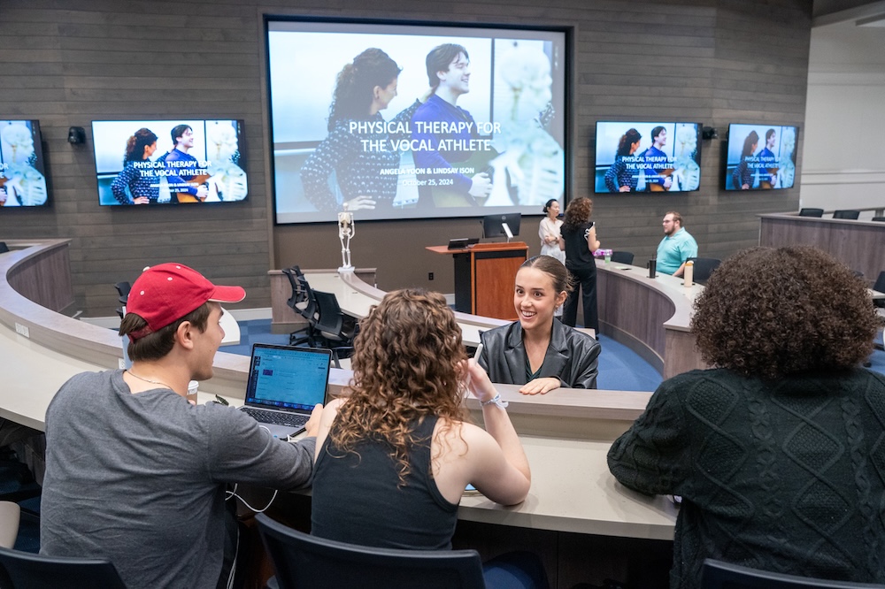 students chat before class begins