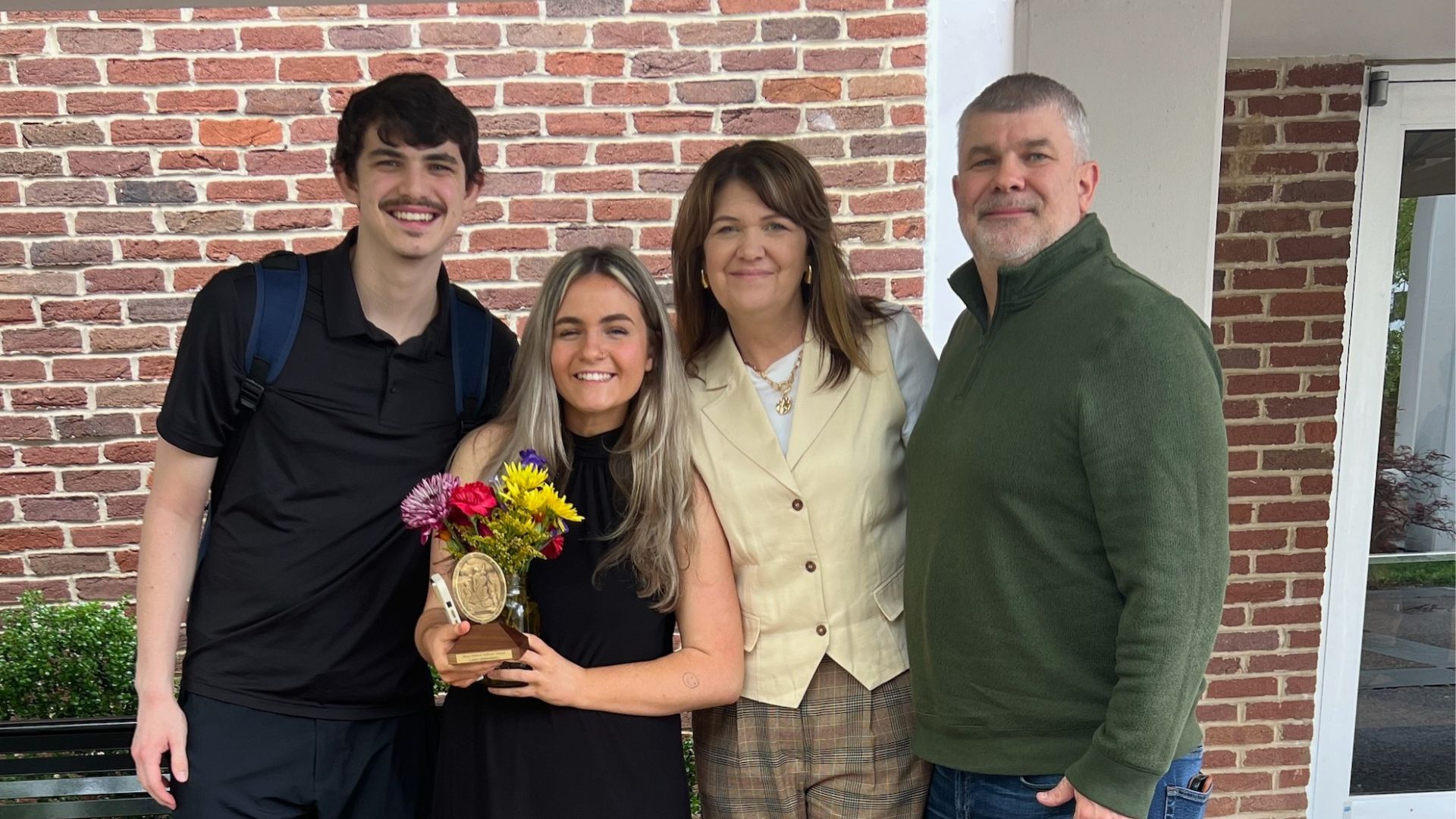 Deffendoll with her family and boyfriend after winning the Mary Mildreal Sullivan Award