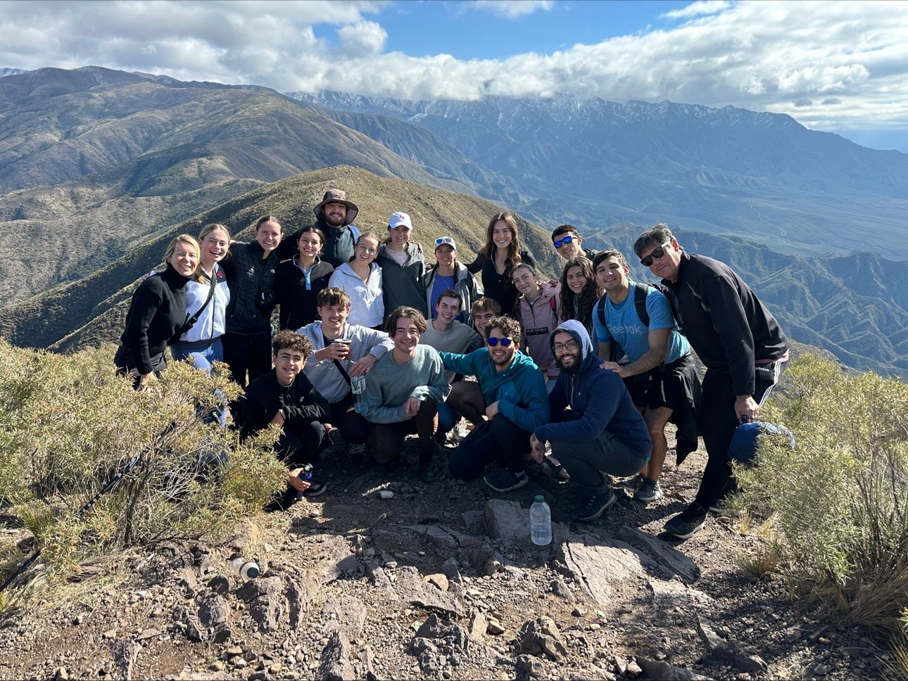 Belmont group pose on top of mountain in Mendoza, Argentina