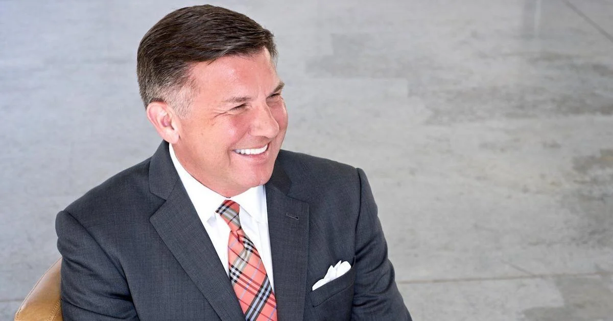 Michael Burcham smiling and looking off-camera