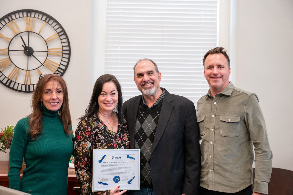 Allen holds scholarship certificate