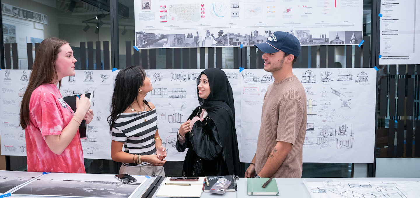 Four O'More students work side by side on their architecture/interior design collaborative project