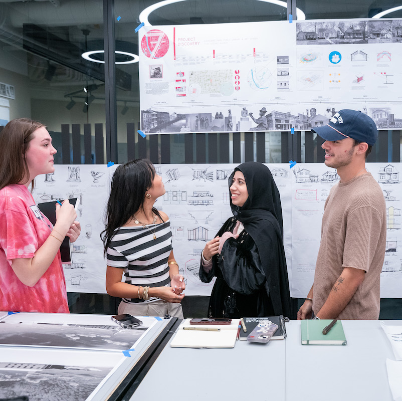 Four O'More students work side by side on their architecture/interior design collaborative project