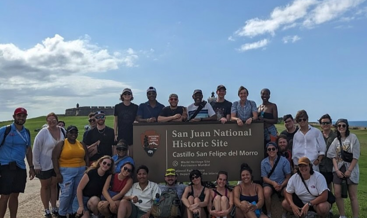 group in front of San Juan National Historic site sign
