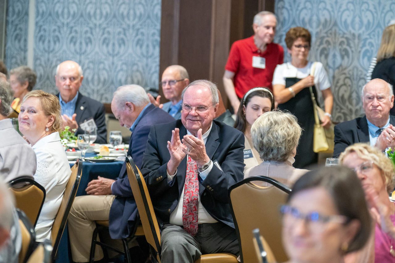 Attendees clap during Tower Society luncheon