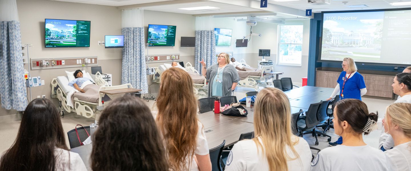 Simulation Center staff addresses nursing students