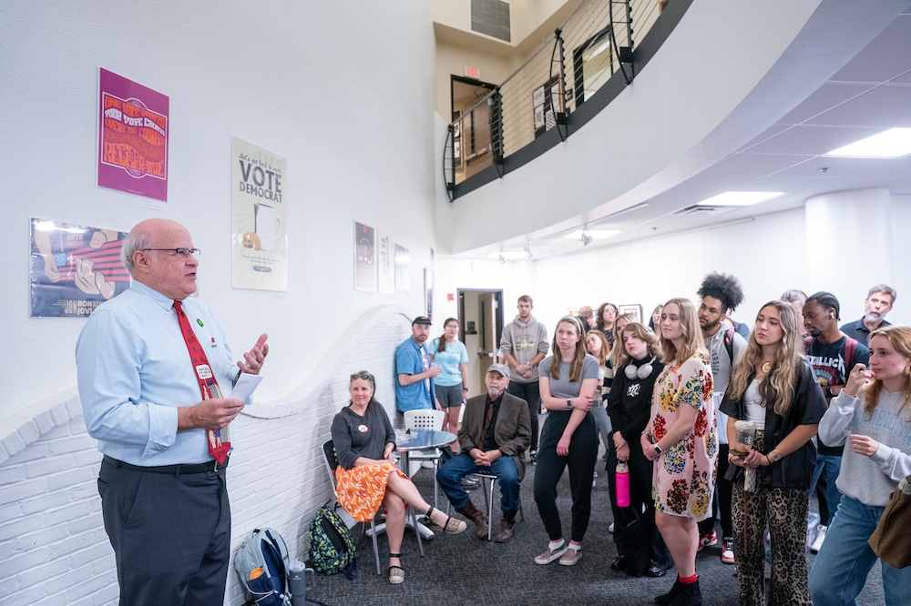 Steine giving remarks at the gallery talk event