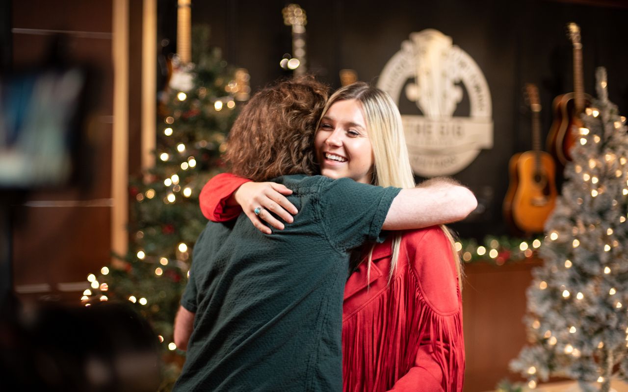 Emma Moyen and Lucas Rennie hug after their performance