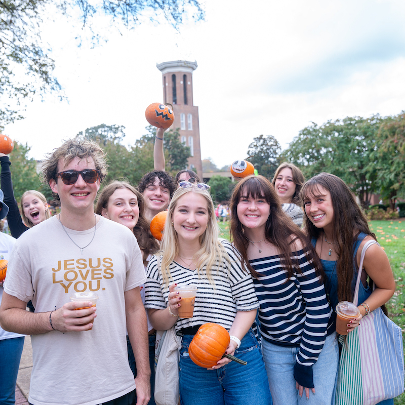 Group of student at Bell Tower with pumpkins