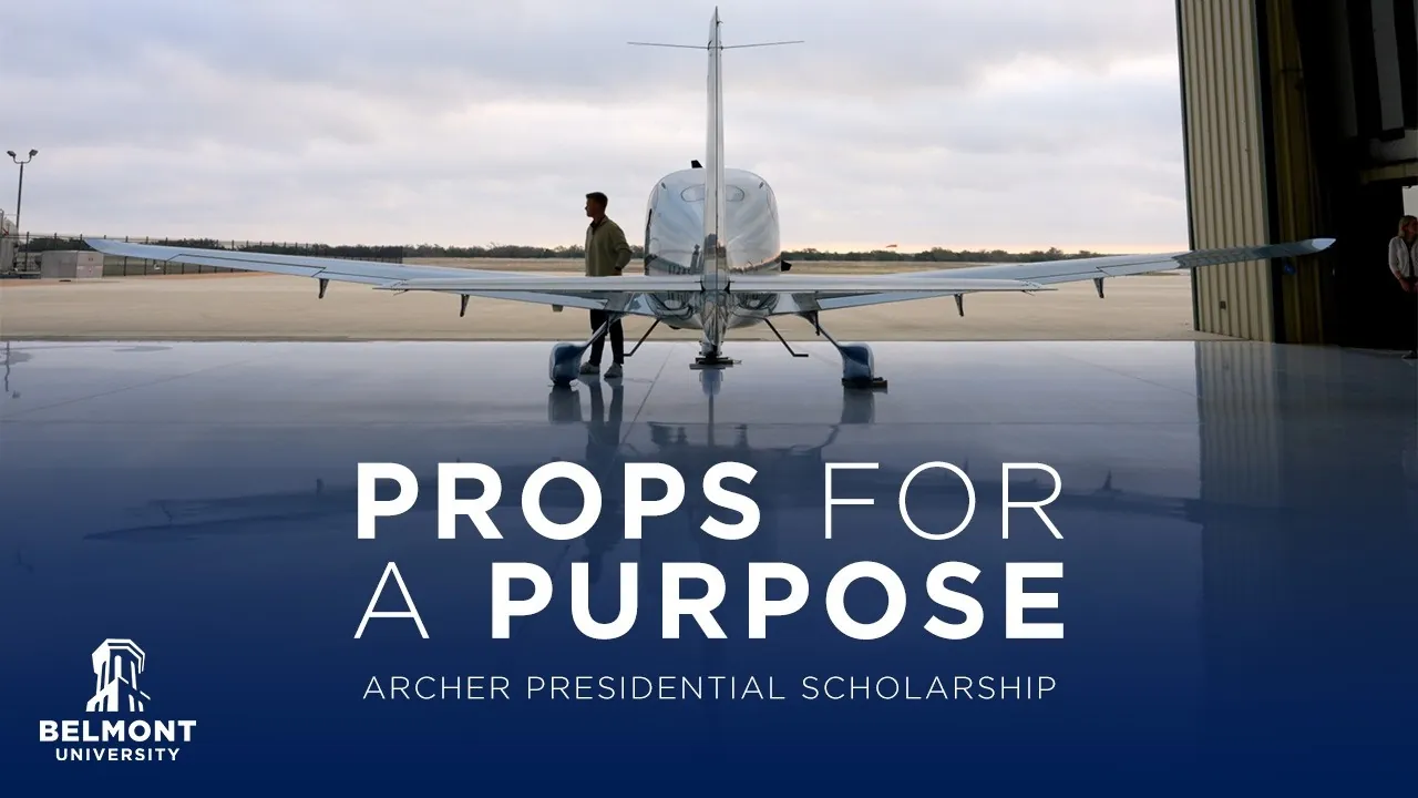 Business professional standing near a plane on a runway with text "Props for a Purpose - Archer Presidential Scholarship" and Belmont University logo