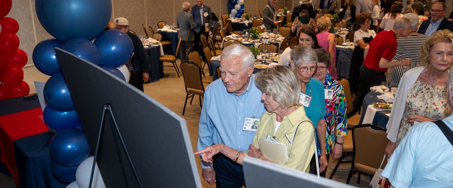 Members of the Tower Society mingle after the luncheon
