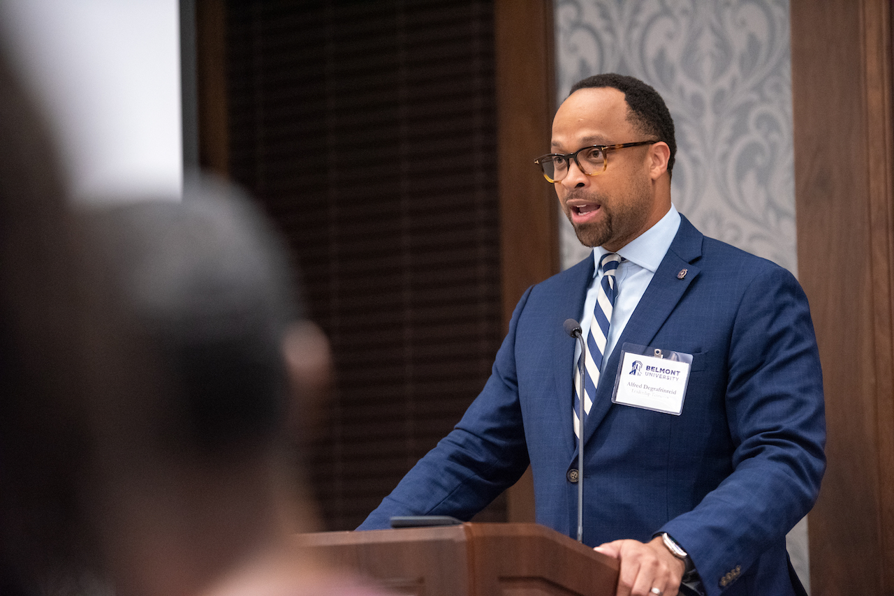 Dr. Degraffenreid speaking at podium