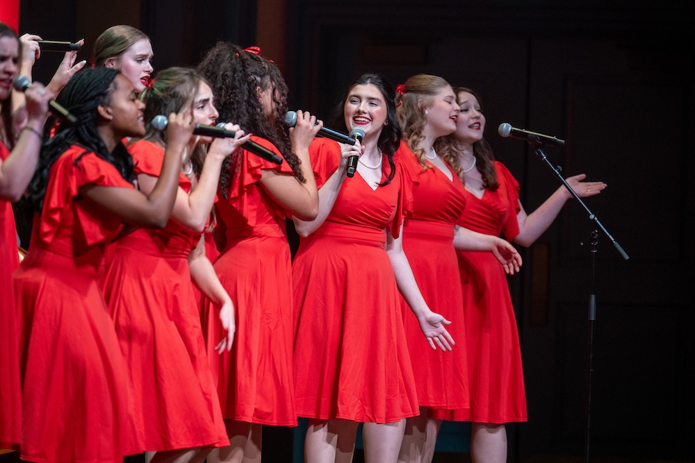 students sing in a line at Christmas at Belmont 2023