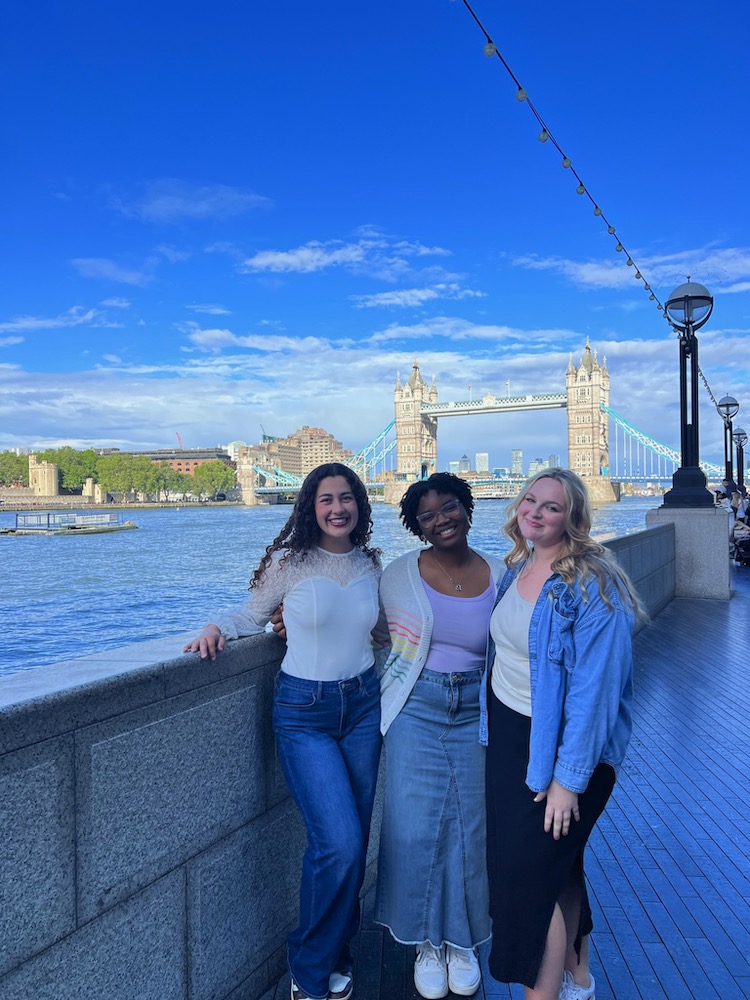 students pose in front of London Tower