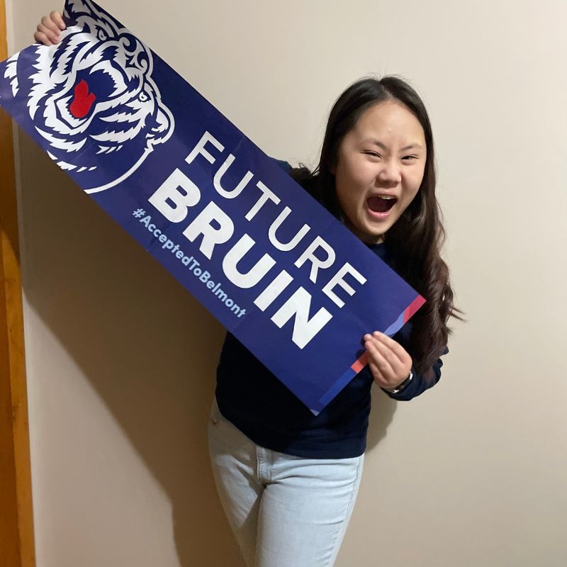 Abbie Cartwright holds sign reading "Future Bruin"