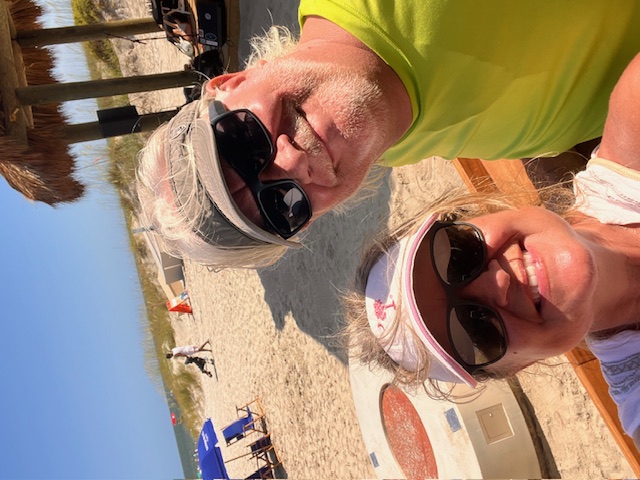 Dr. Beall and her husband on the beach 