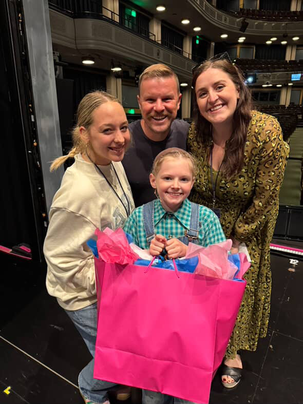 Ellie with a member of the cast and her family