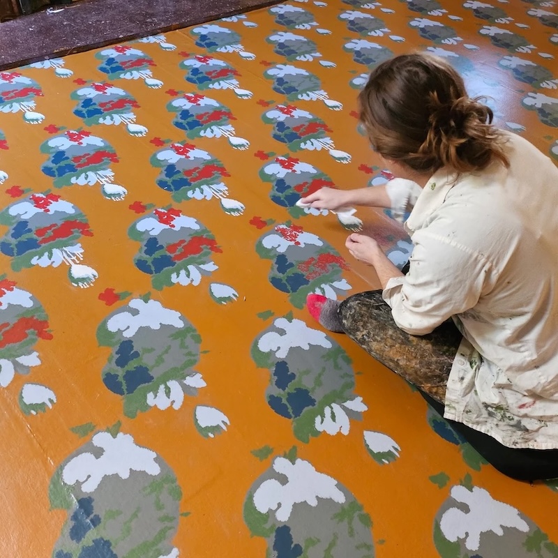 Abernathy works on floor covering