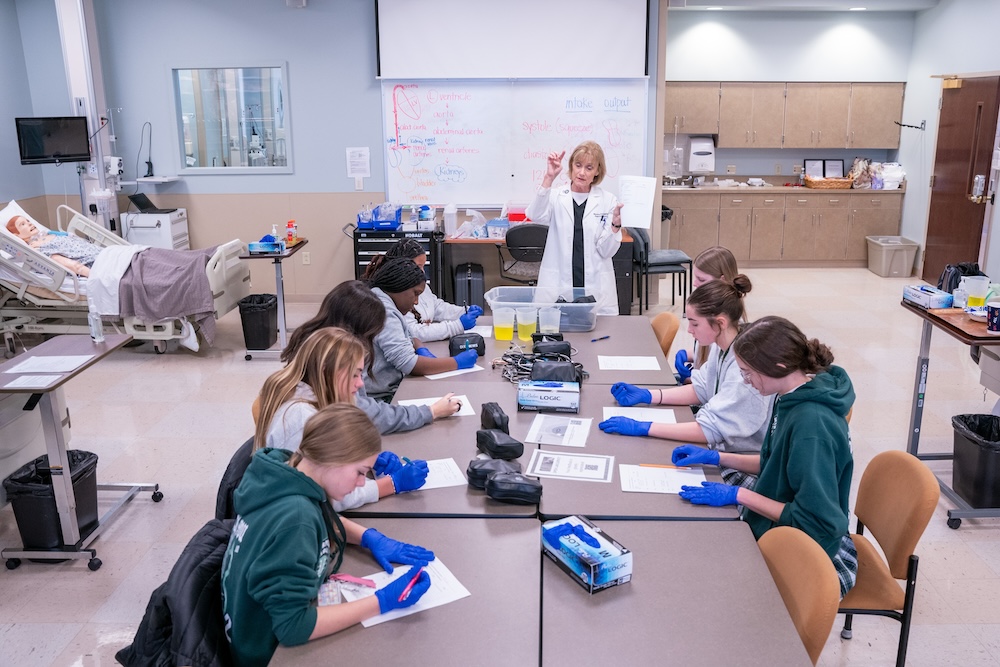 Healthcare 101 students sit for a lesson led by Belmont faculty