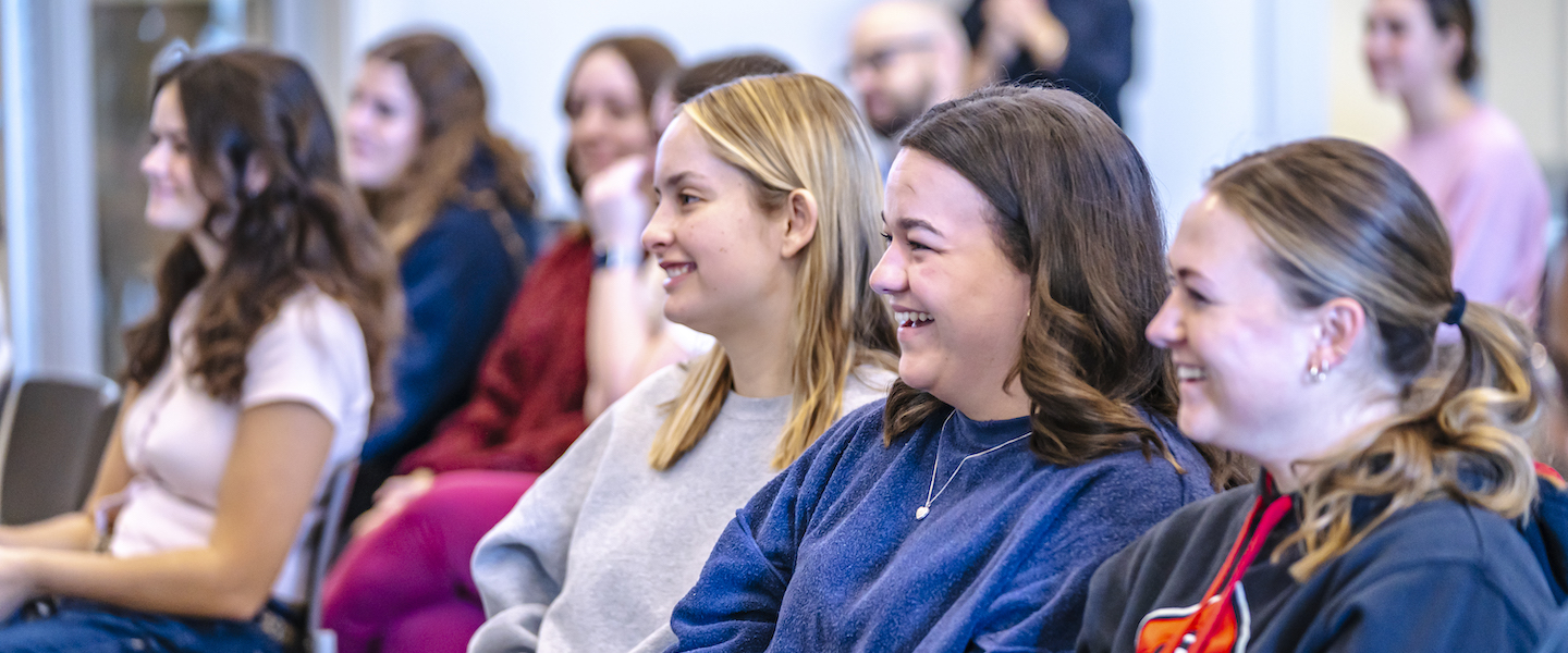 Students smiling during presentation