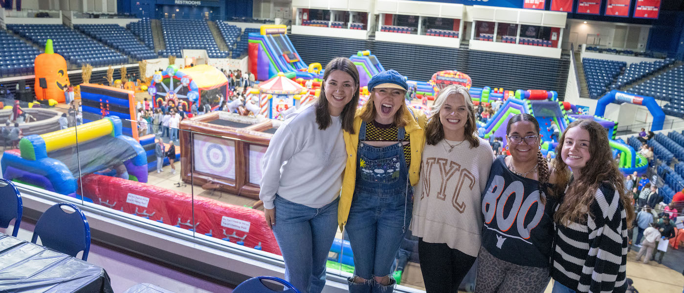 Four students at Day to Dream inside Curb Arena