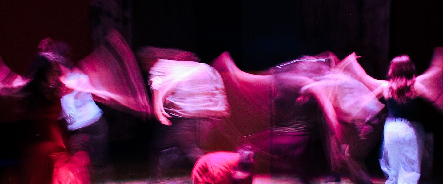 blur of students moving on stage