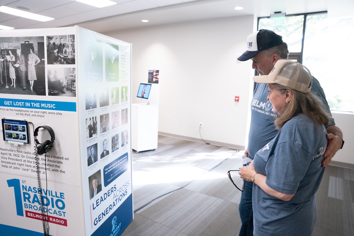 the Jones look at one of the exhibit stations