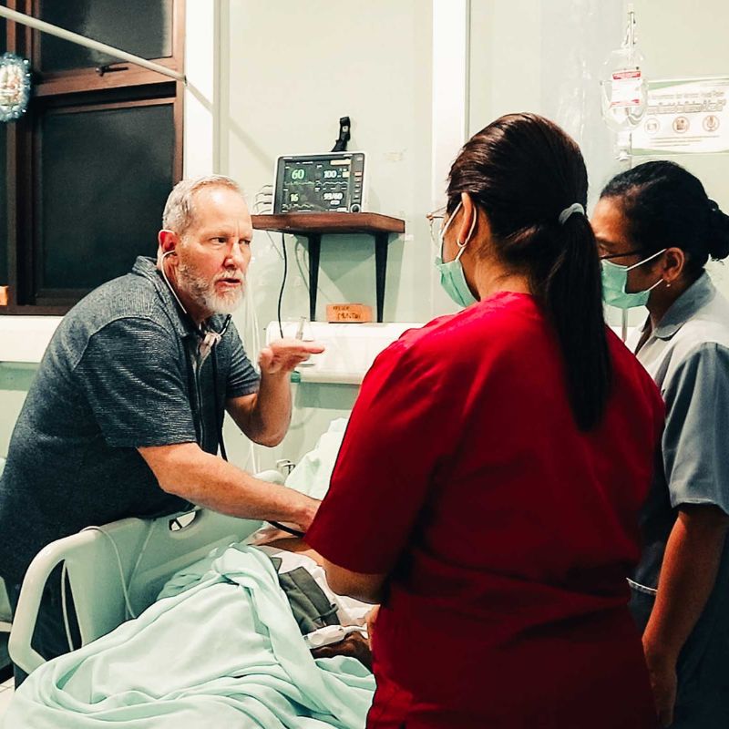 Steve Busby assists in a hospital