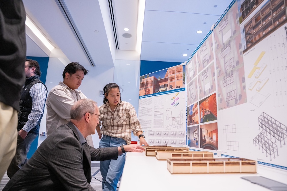 students discuss their designs