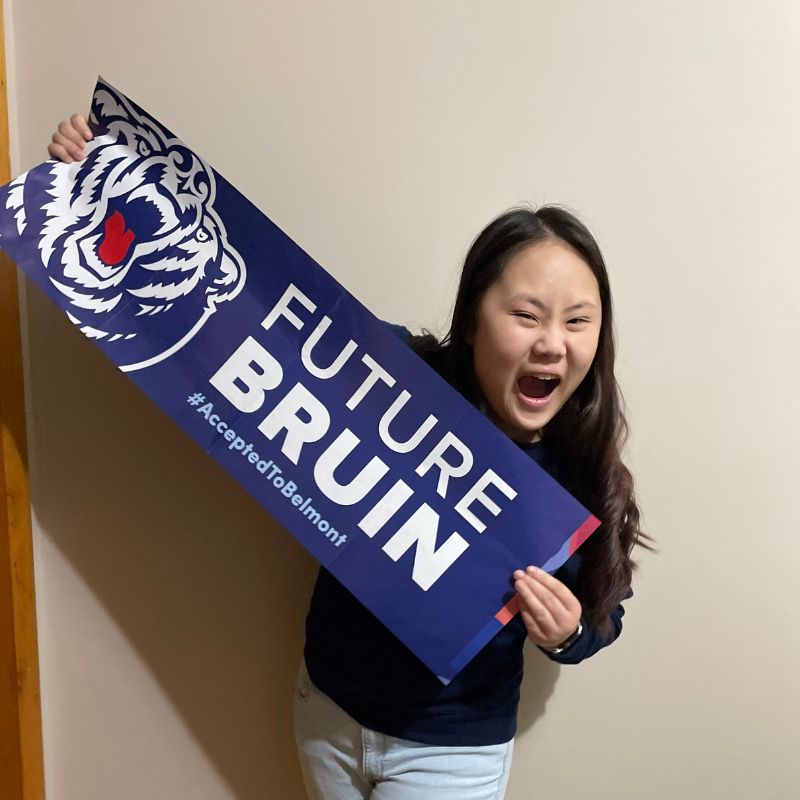 Abbie Cartwright holds up sign reading "Future Bruin"