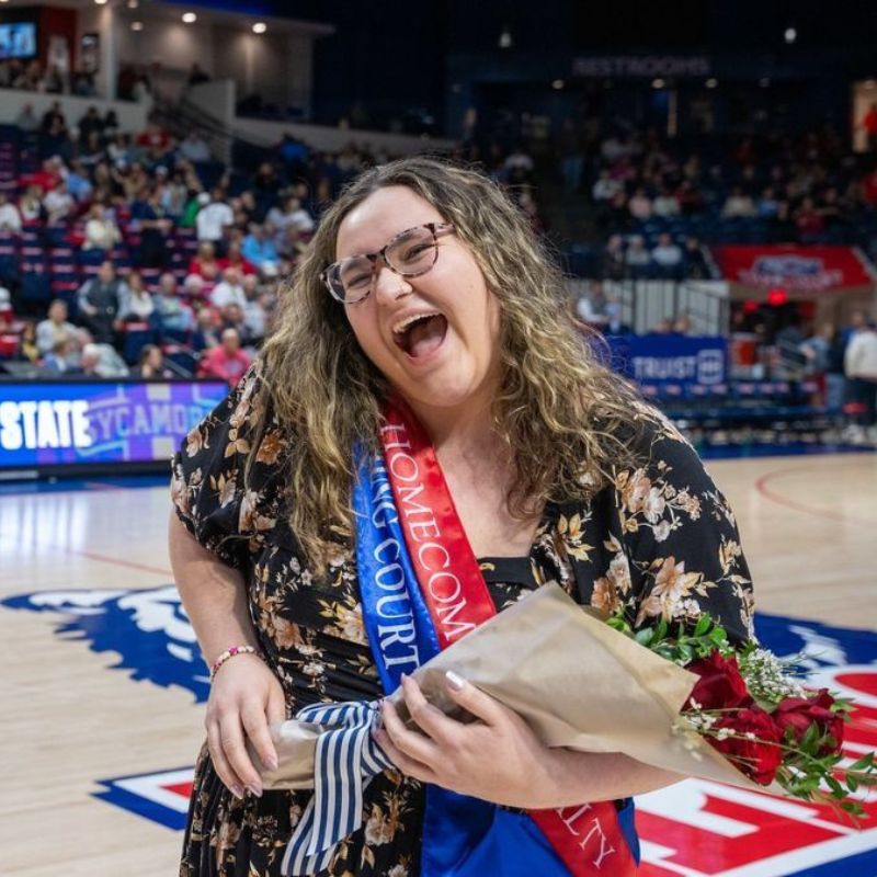 Cora Williams holding bouquet during Homecoming festivities