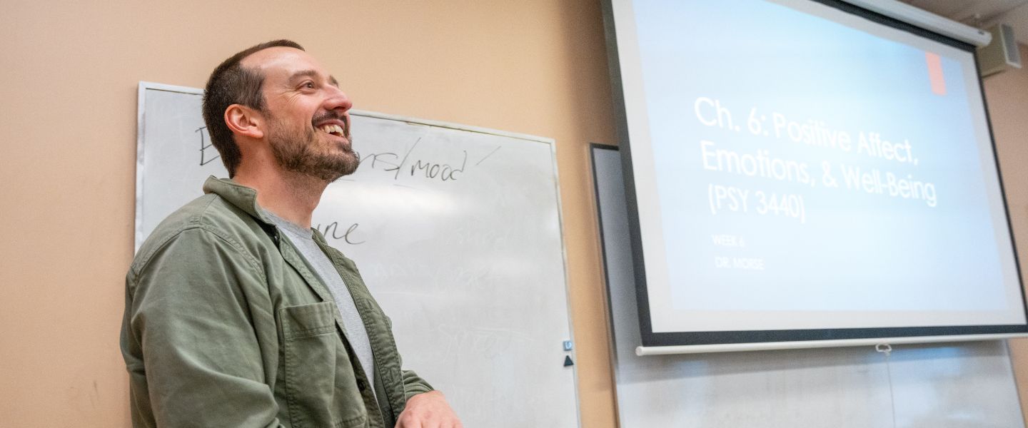 Dr. Patrick Morse in front of a whiteboard