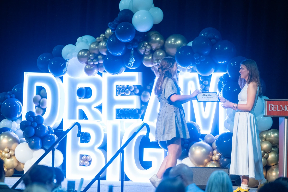 someone receiving an award on stage