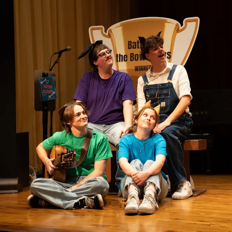 students performing on stage
