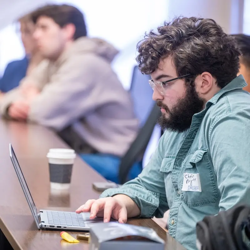 Student on laptop in breakout session