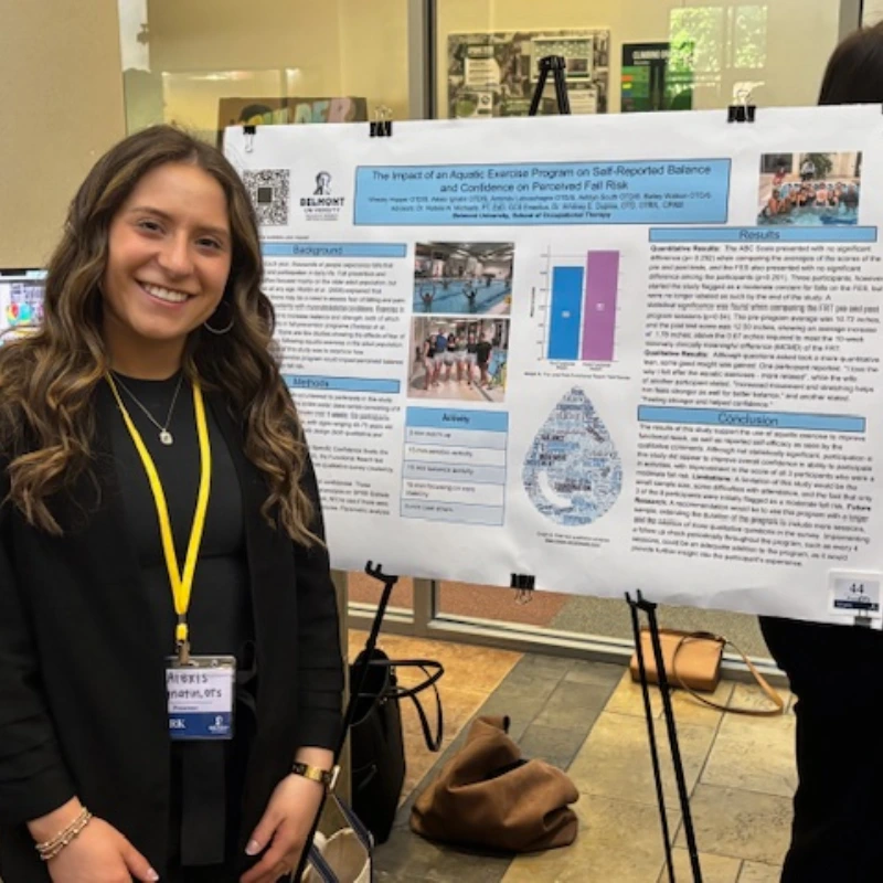 Alexis Ignatin, smiling with her research