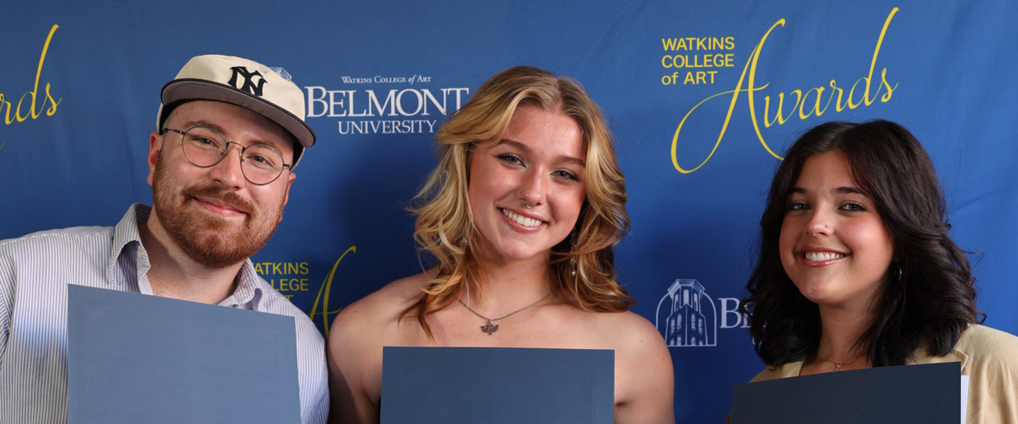 Three smiling students holding Walter and Sarah Knestrick Awards from Watkins College of Art, Belmont University.
