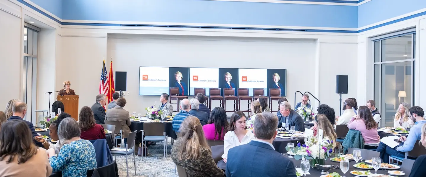 Commissioner Margie Quin speaks at the event