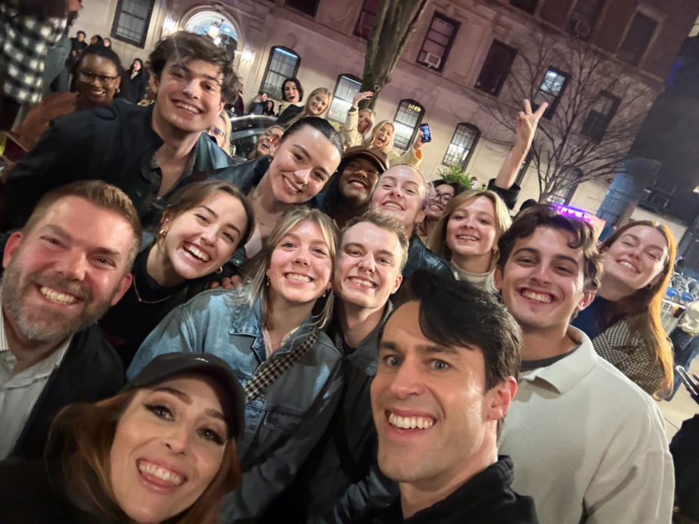 Fellow alumni take a selfie with Watts