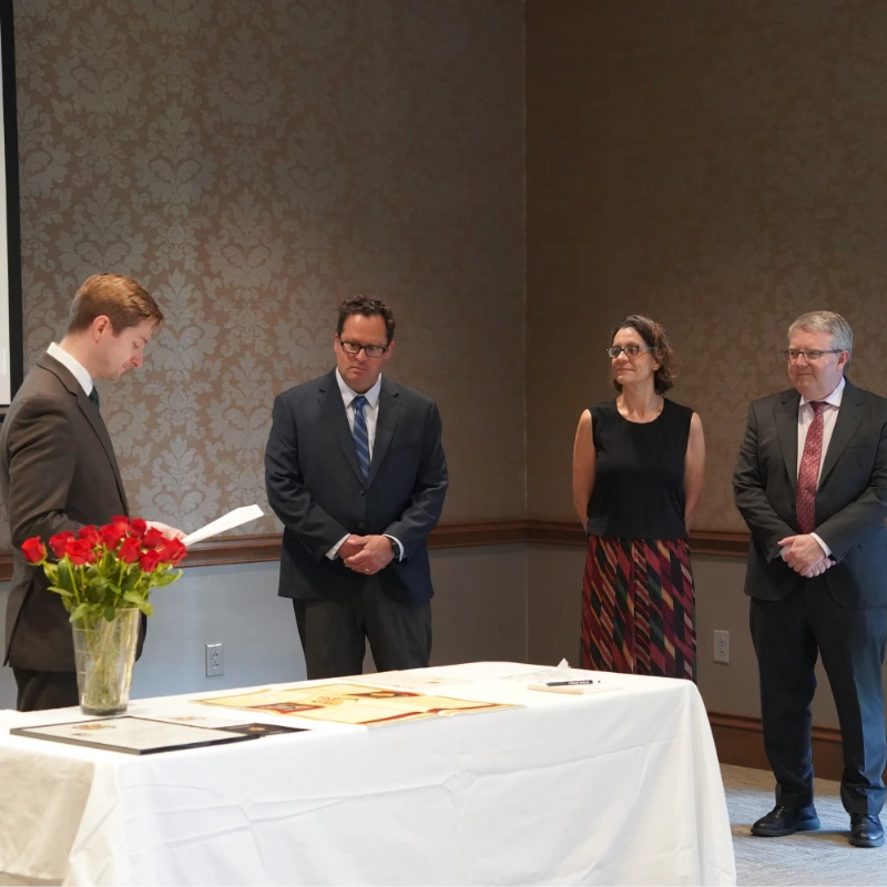 Three faculty members being initiated into Belmont's chapter of Sigma Delta Pi