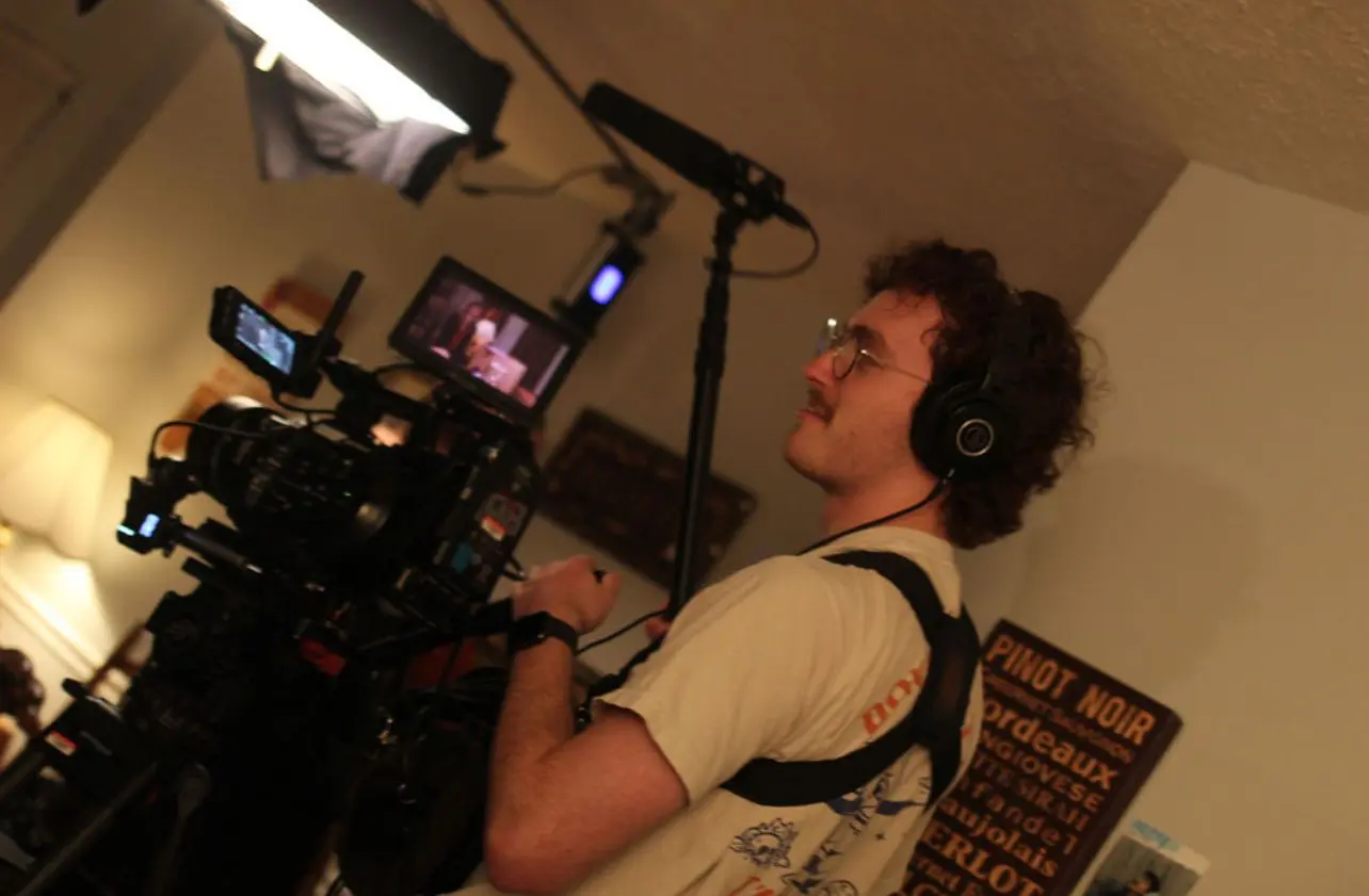 Joe Crews recording audio on set