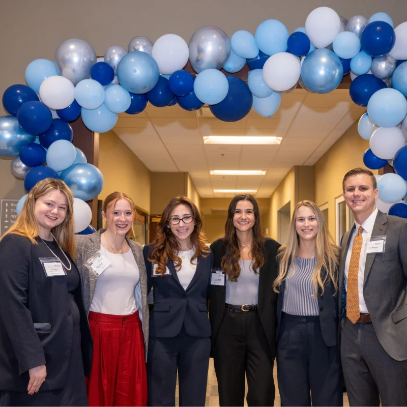 People smile at the law symposium 