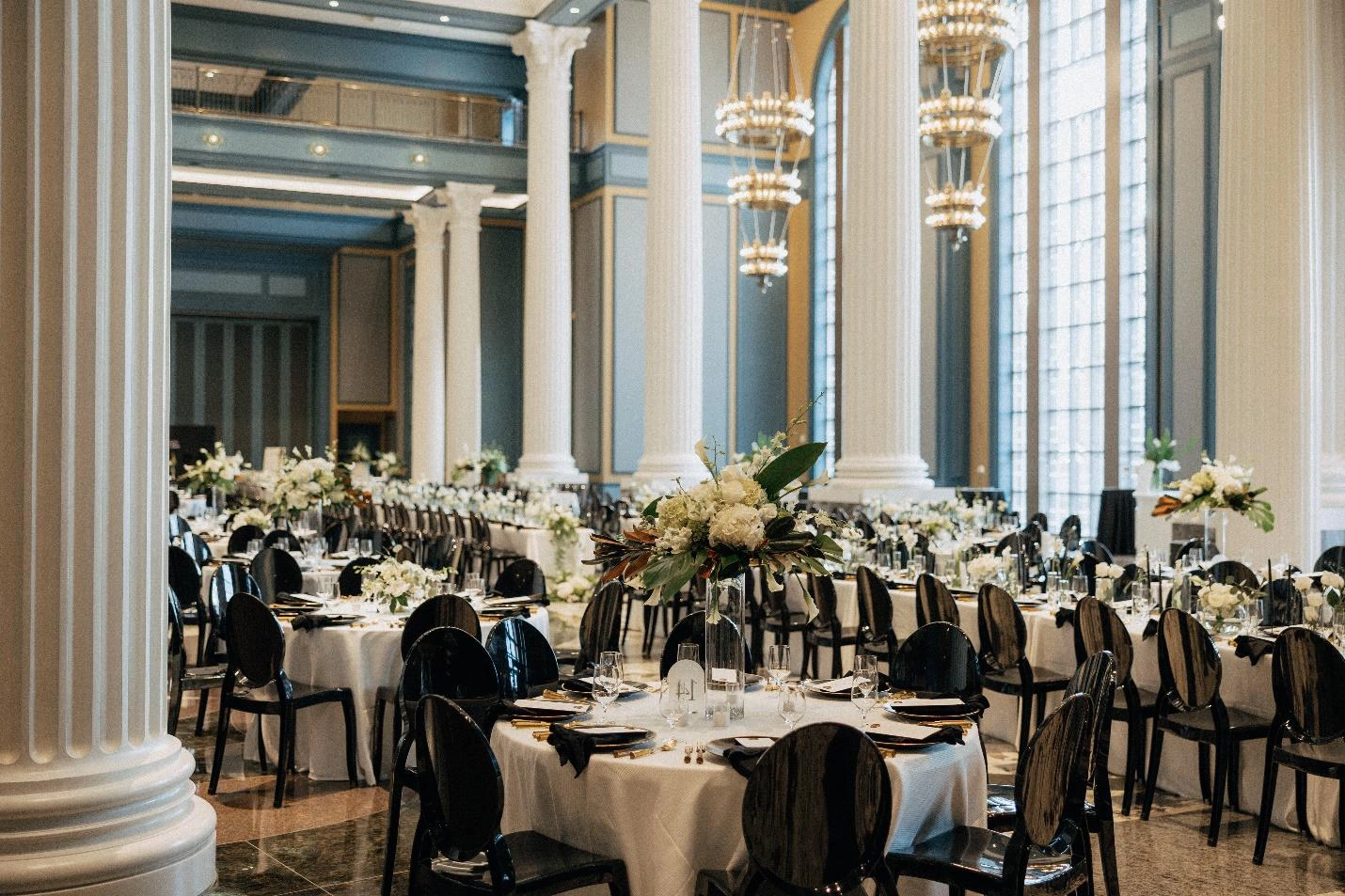 Tables and chairs decorated for a wedding in the Fisher Center entrance/lobby