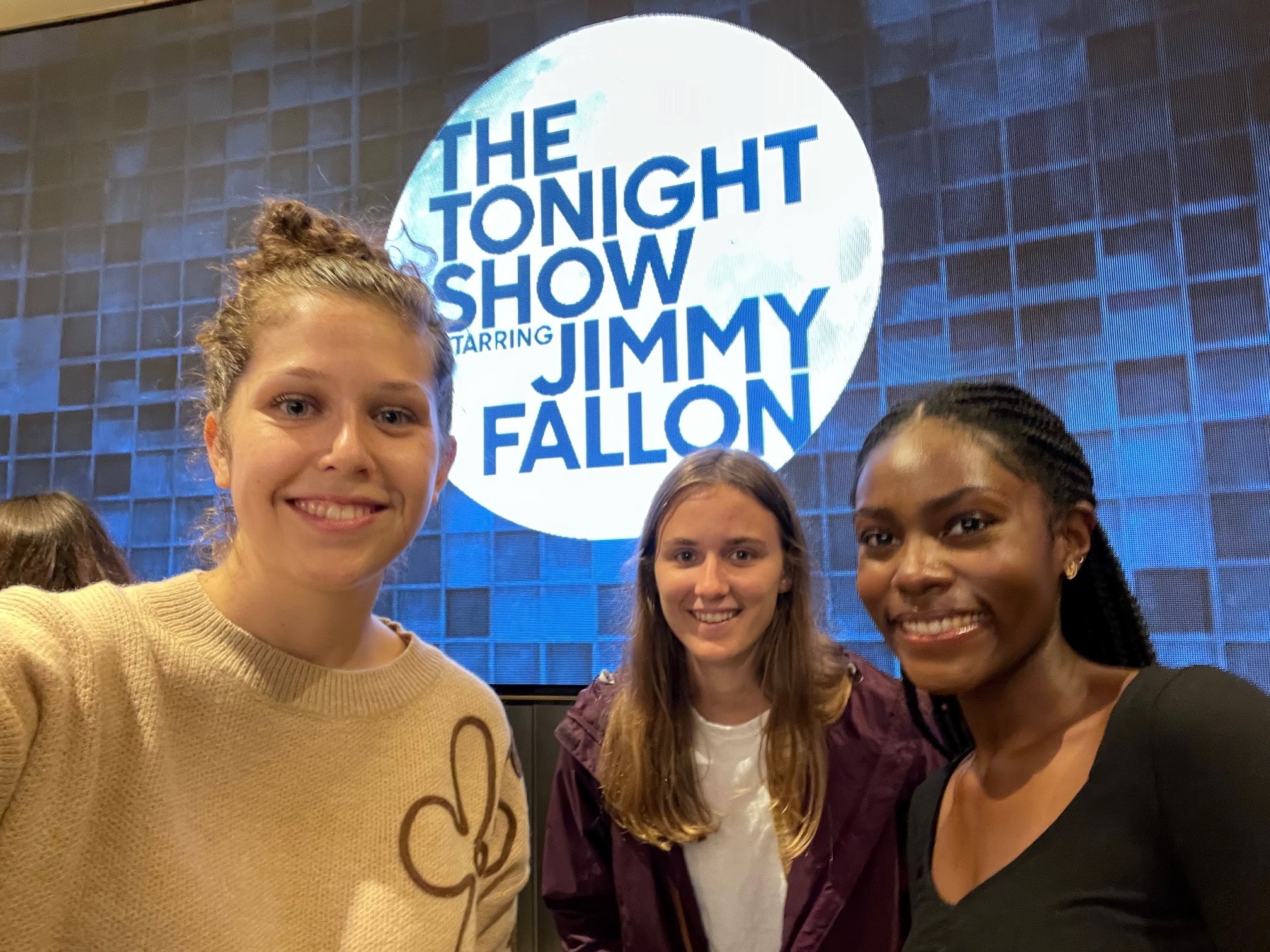 Belmont East students pose for picture in front of the Tonight Show logo