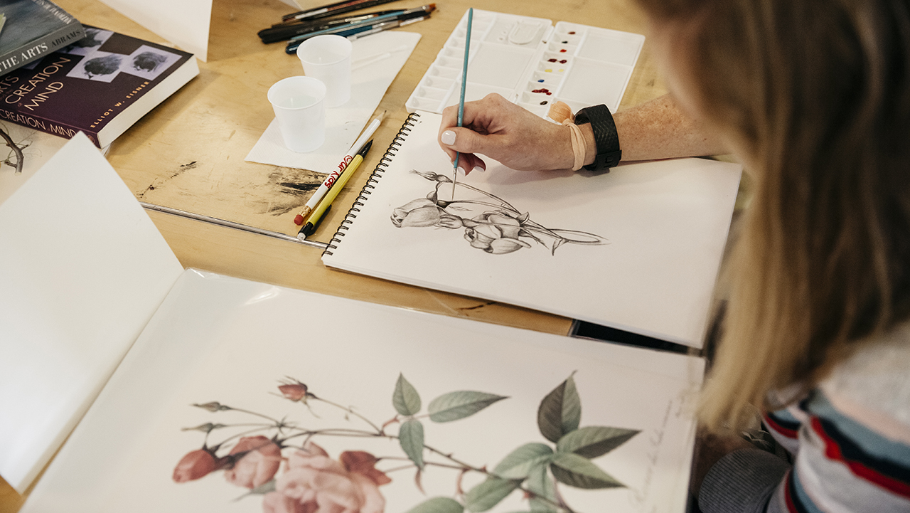 Student working on a botanical drawing. 