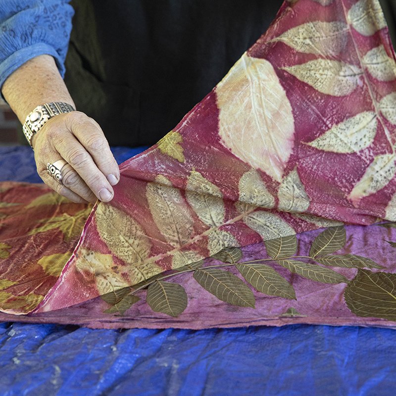 hand unwrapping botanical printed fabric